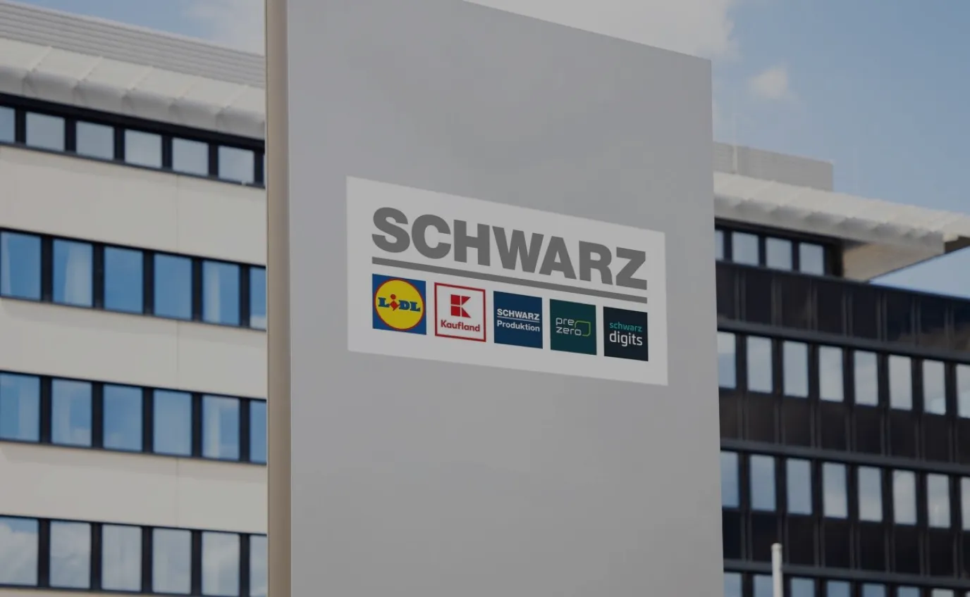 A Schwarz Group (Lidl) store building with signs, symbolizing retail digitalization with ThingsBoard.